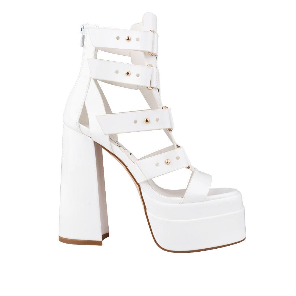 white-colored platform heels for ladies with ornamental buckle straps and ankle buckle clasp-side view