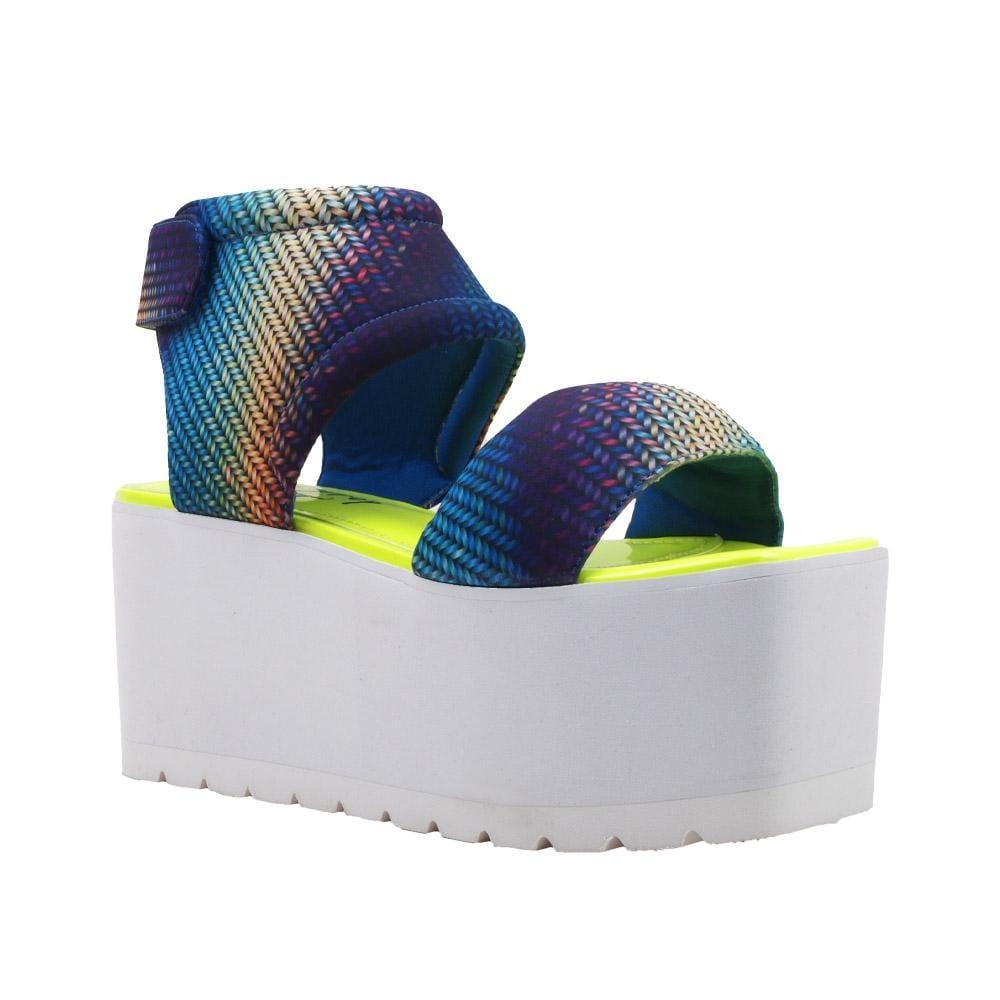 Women's platform shoes with a blue-yellow pattern on the upper, a velcro clasp, and a white bottom-corner view