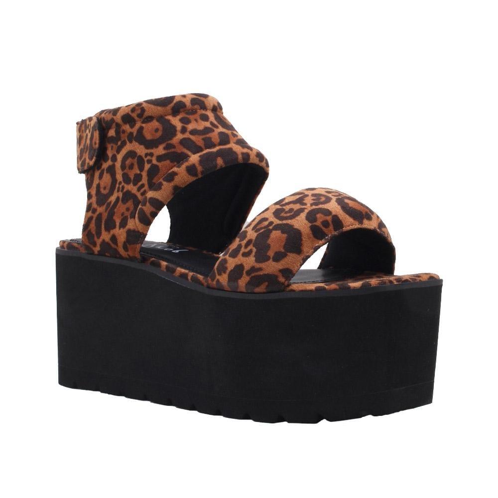 Women's platform shoes featuring tan-leopard design on the upper, velcro clasp, and a black sole-corner view