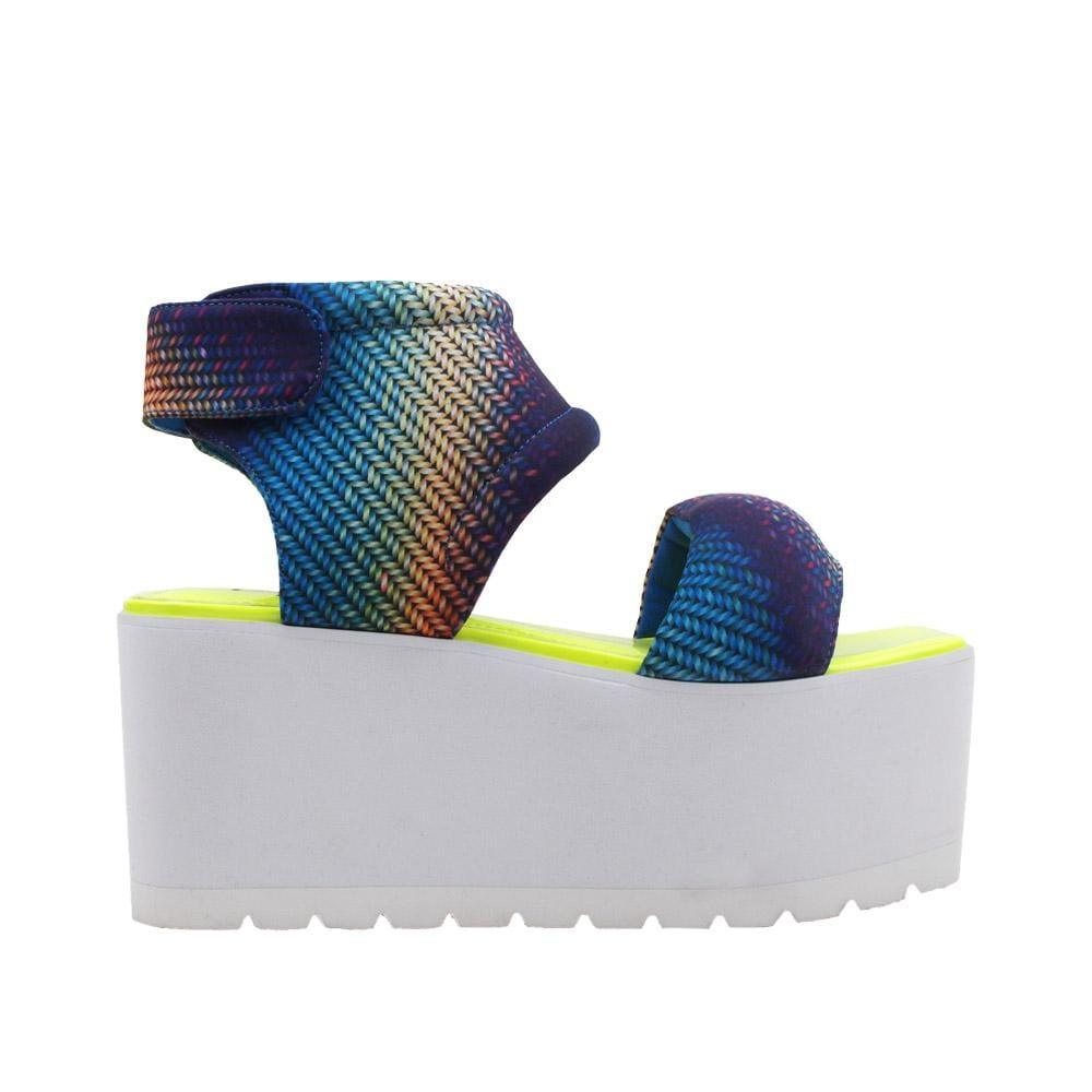 Women's platform shoes with a blue-yellow pattern on the upper, a velcro clasp, and a white bottom-side view