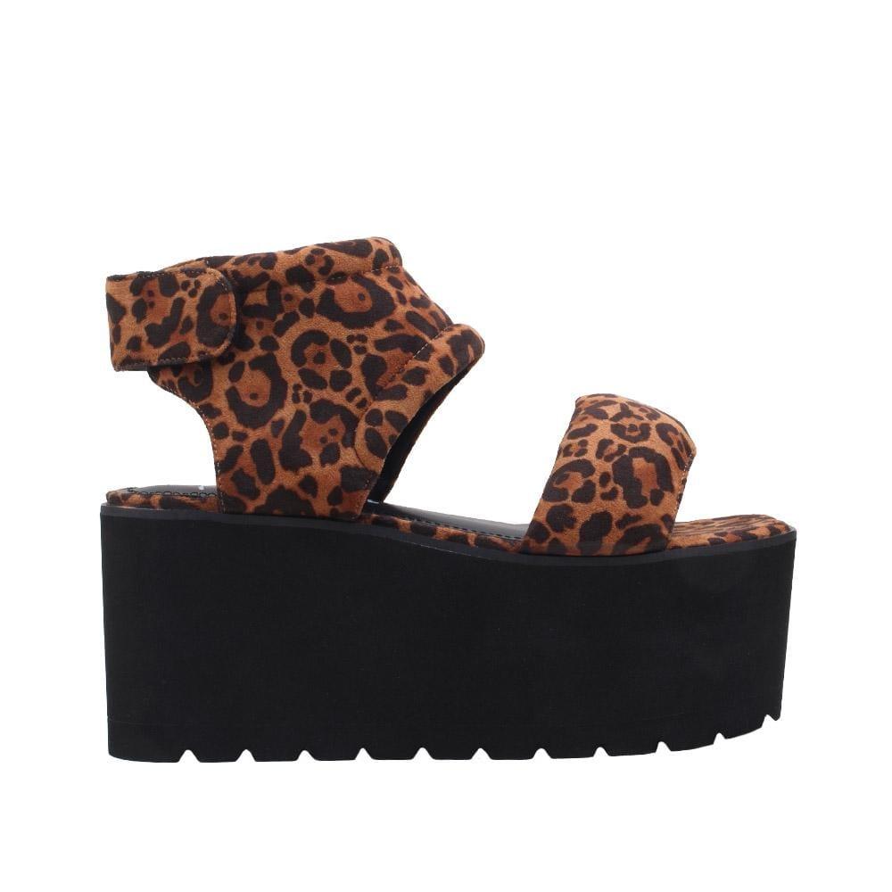 Women's platform shoes featuring tan-leopard design on the upper, velcro clasp, and a black sole-side view