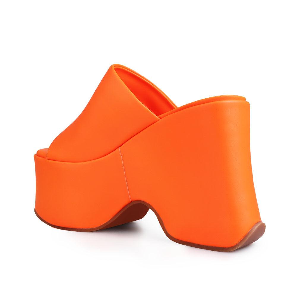 women's orange-colored platform with slip style-posterior view