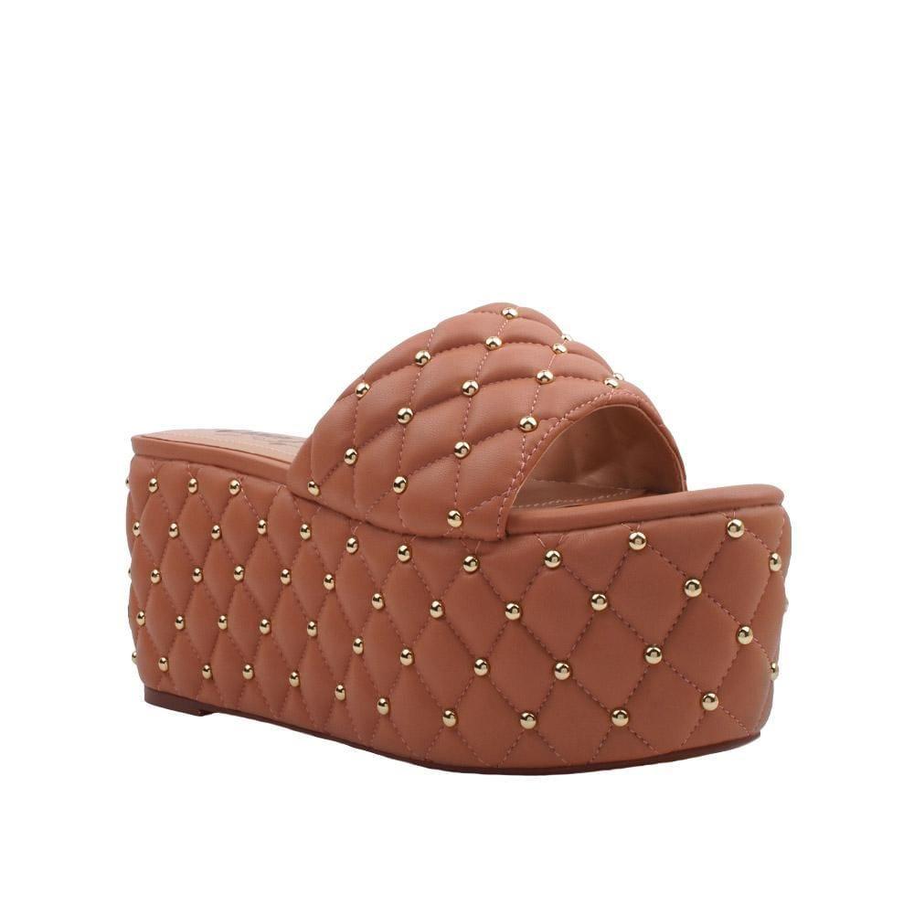 Women's tan-colored open-toed platform shoes with metallic studs and a slip-on design-corner view