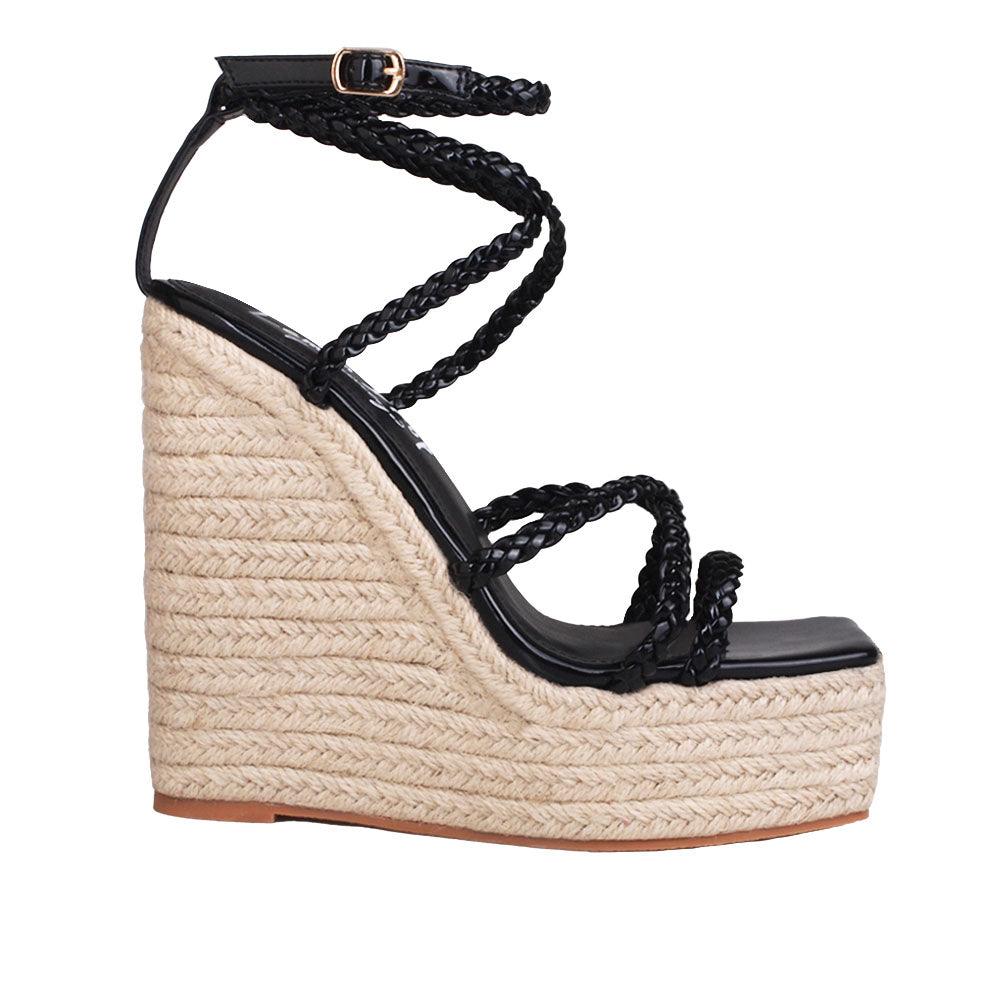 Tan wedge heels for ladies with black-colored upper strap and ankle buckle clasp-side view