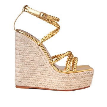 women's tan-colored wedge heels with golden upper strap and ankle buckle clasp-side view