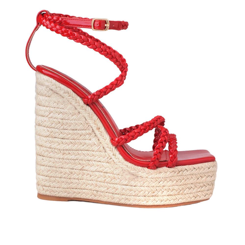 Women's tan wedge heels with crimson-colored upper strap and an ankle buckle clasp-side view