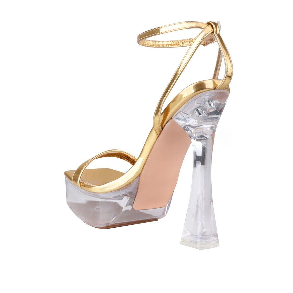 Transparent platform heels for women with golden-colored top and ankle buckle clasp-posterior view