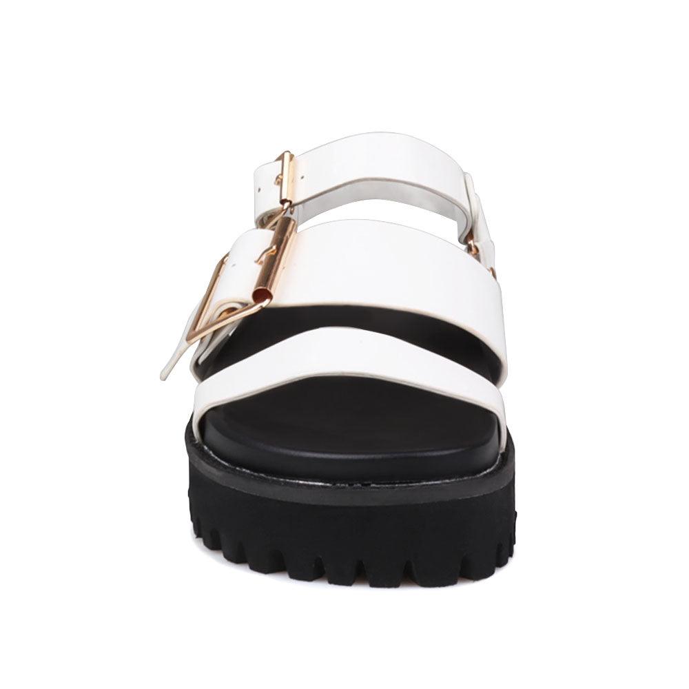 Women's white platform with buckle straps, ankle buckle closure, and black bottom-front view