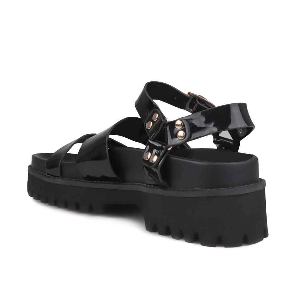 Women's platform in black-color with buckle straps and ankle buckle fastening-posterior view