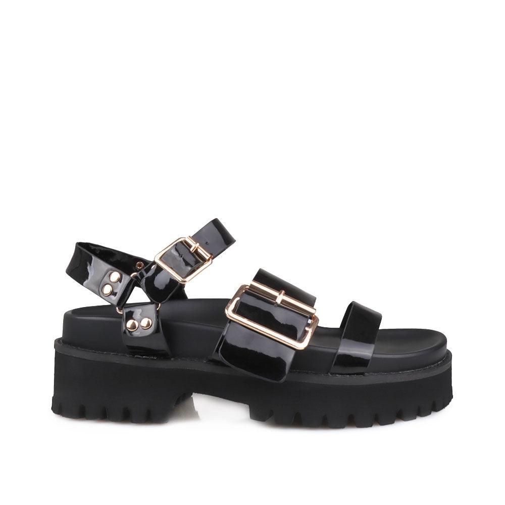 Women's platform in black-color with buckle straps and ankle buckle fastening-side view