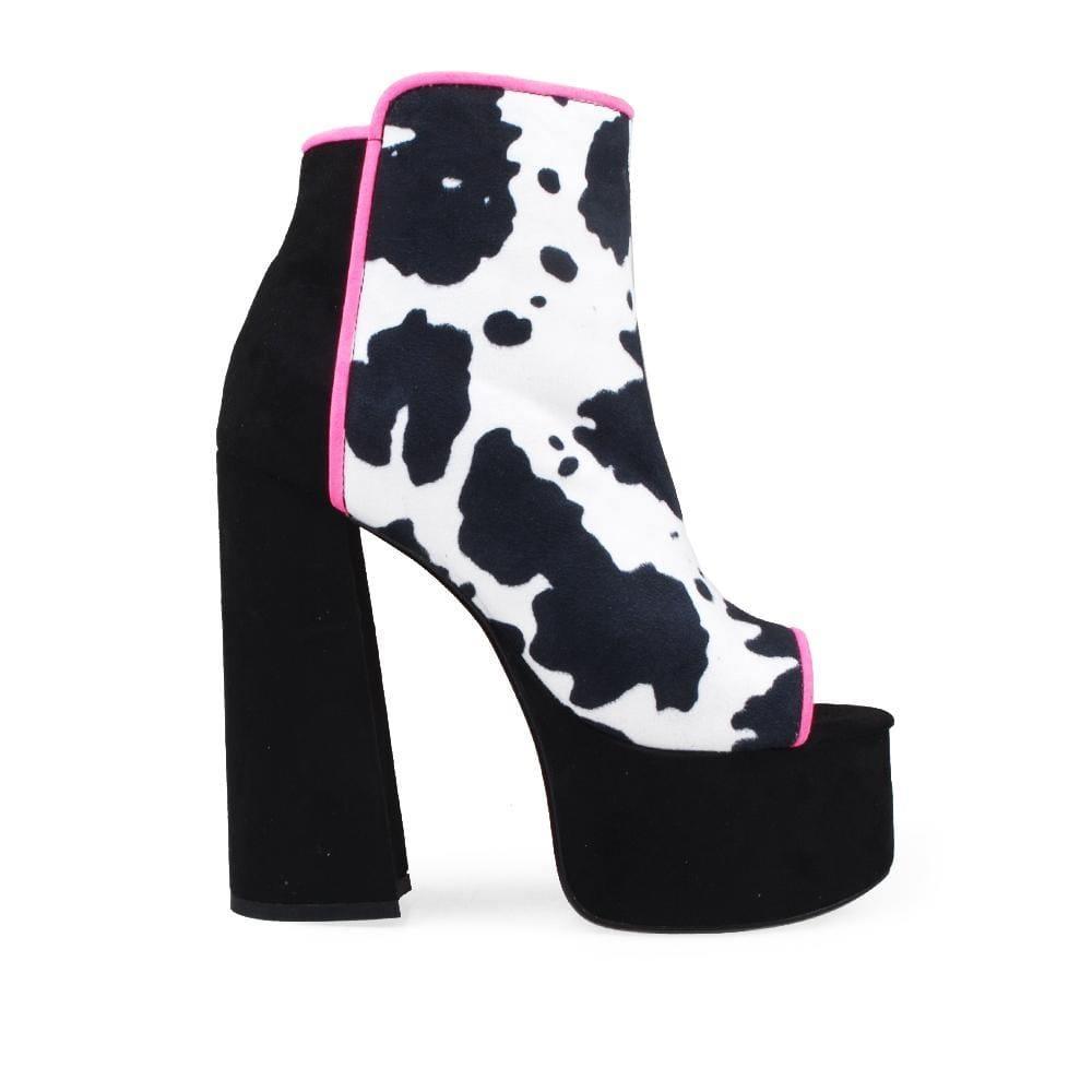 Black-colored women's ankle platform block heels with open toe, black-white pattern upper and side zipper closure.