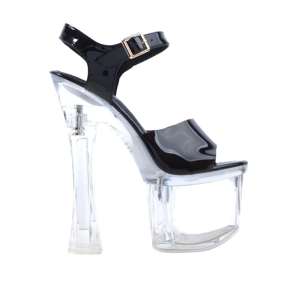 Ladies' clear platform heels with black-colored top and ankle buckle clasp.