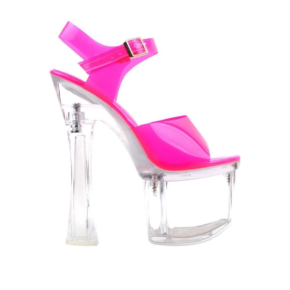 Transparent platform heels for ladies with pink-colored top and ankle buckle fastening.