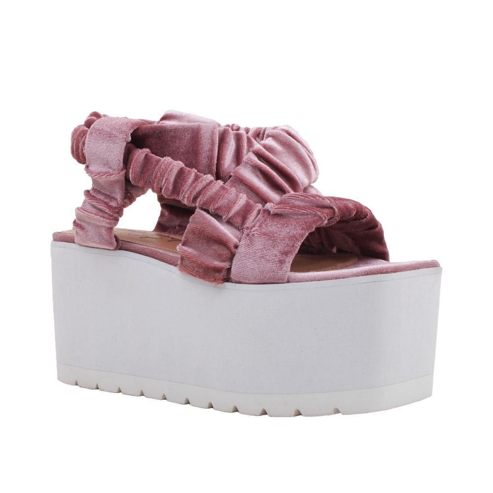 Baby pink women shoes with black colored platform-corner view