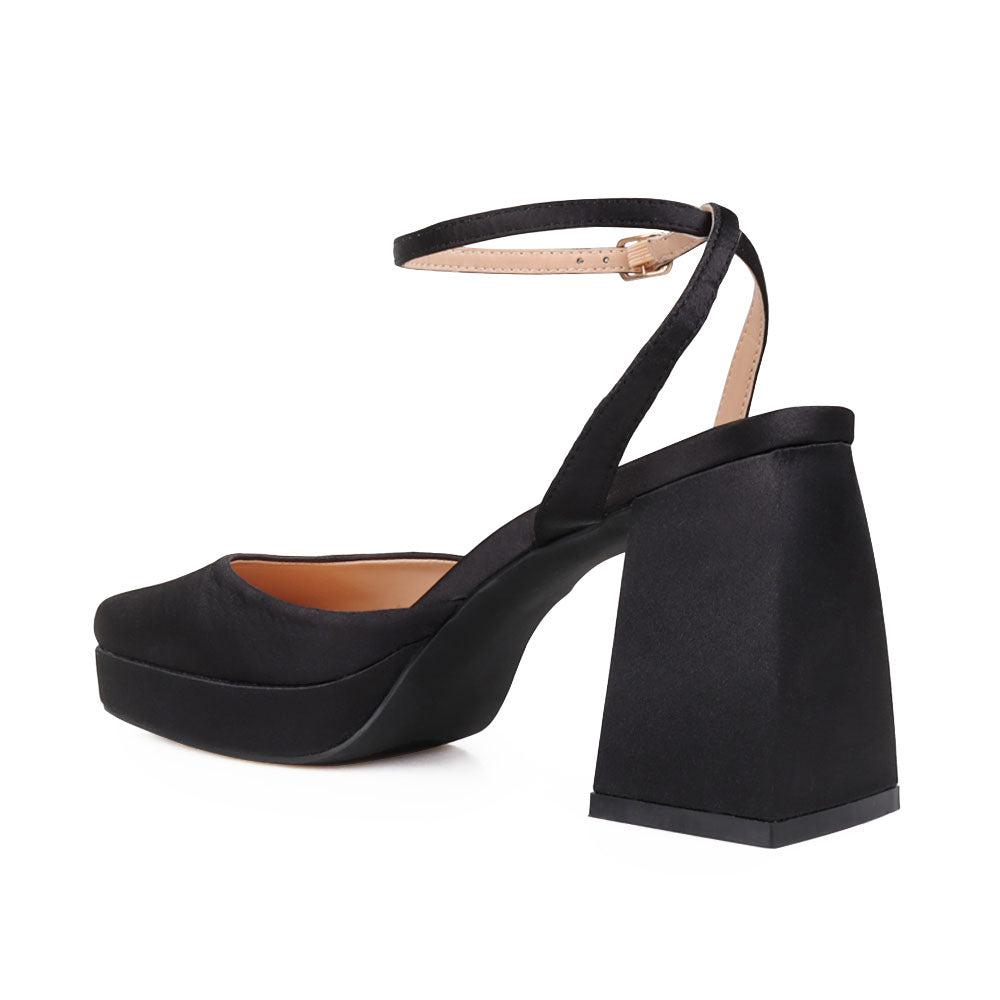 Black colored women platforms with ankle buckle-posterior view