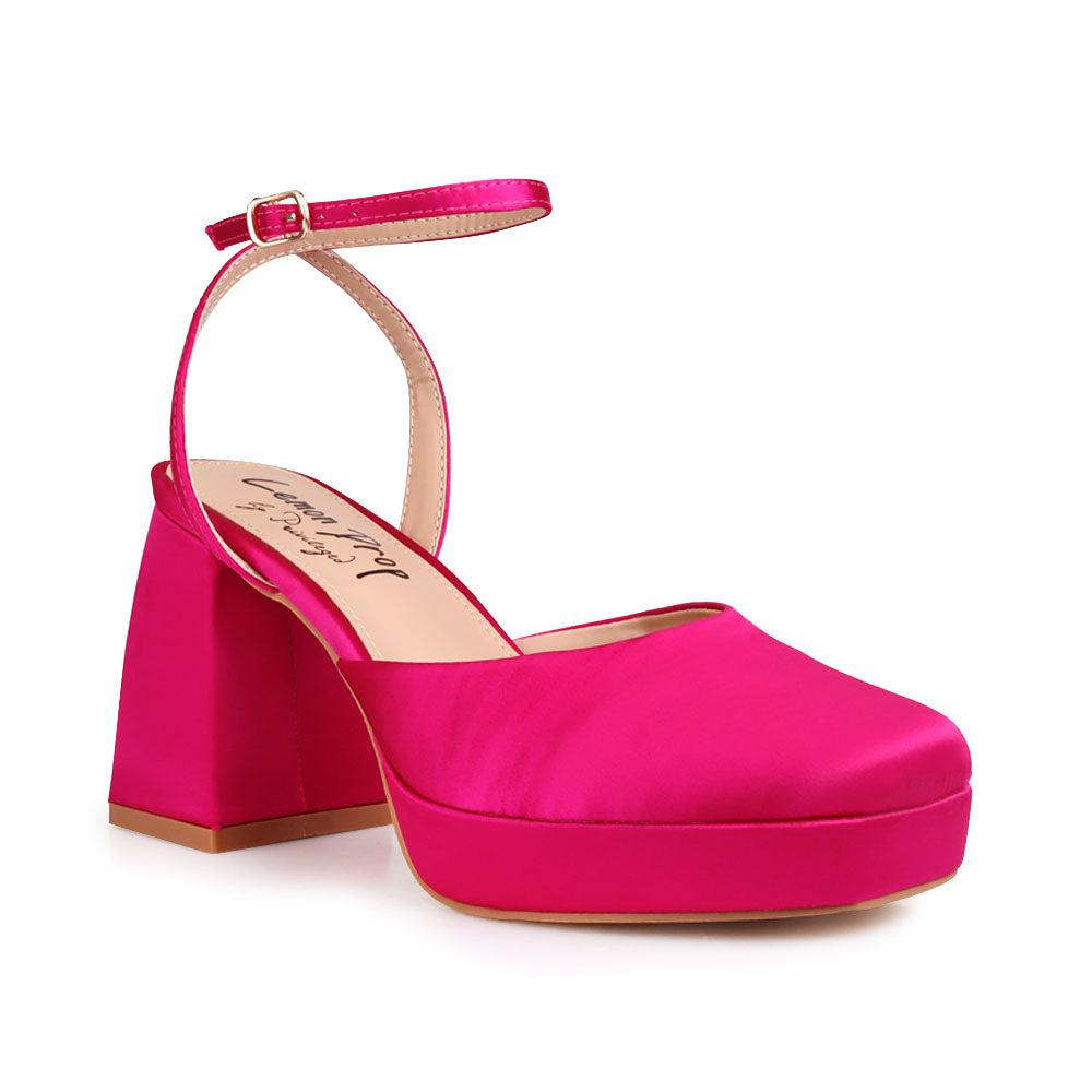 Pink colored women platforms with ankle buckle-corner view