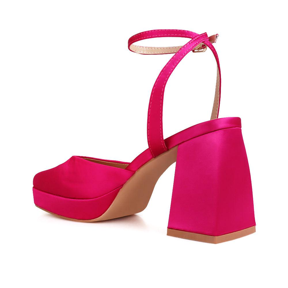 Pink colored women platforms with ankle buckle-posterior view