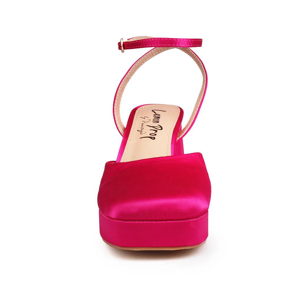 Pink colored women platforms with ankle buckle-front view