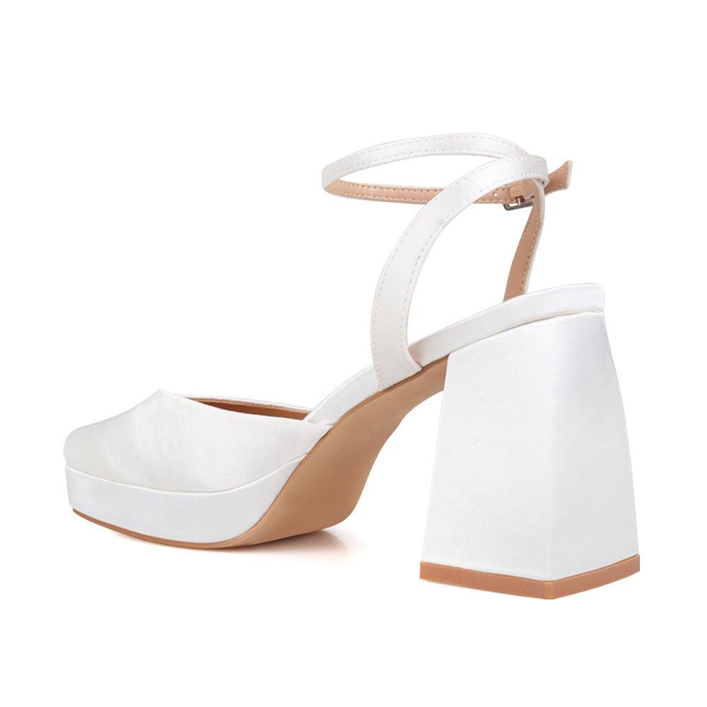 White women platforms with ankle buckle-posterior view