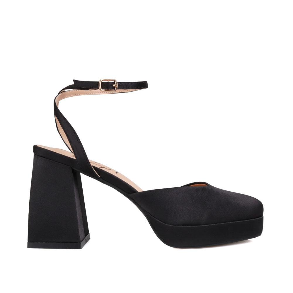 Black colored women platforms with ankle buckle-side view