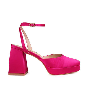 Pink colored women pltforms with ankle buckle-side view