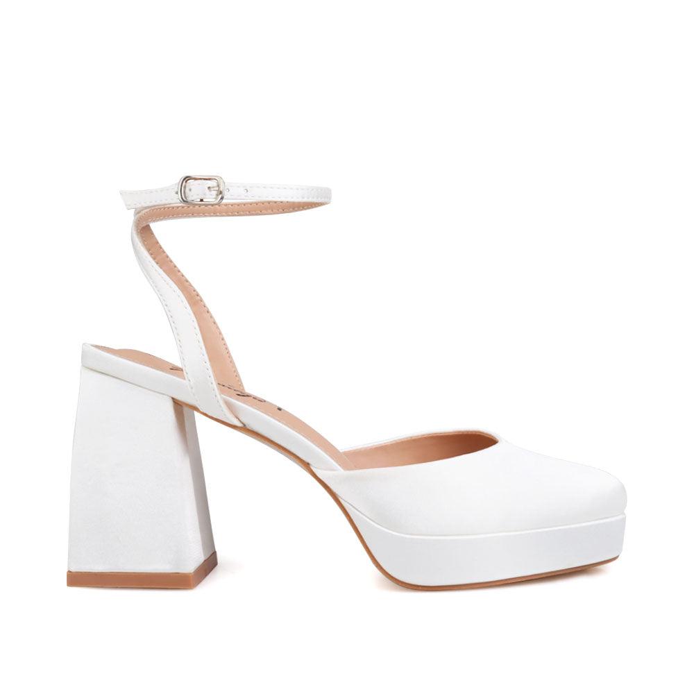 White women platforms with ankle buckle-side view