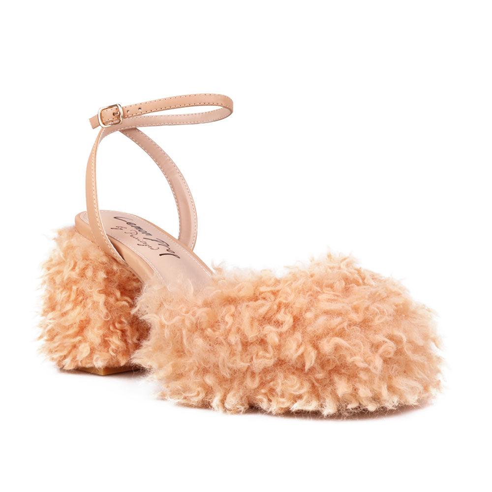 Nude colored women heel with vegan shearing upper-corner view