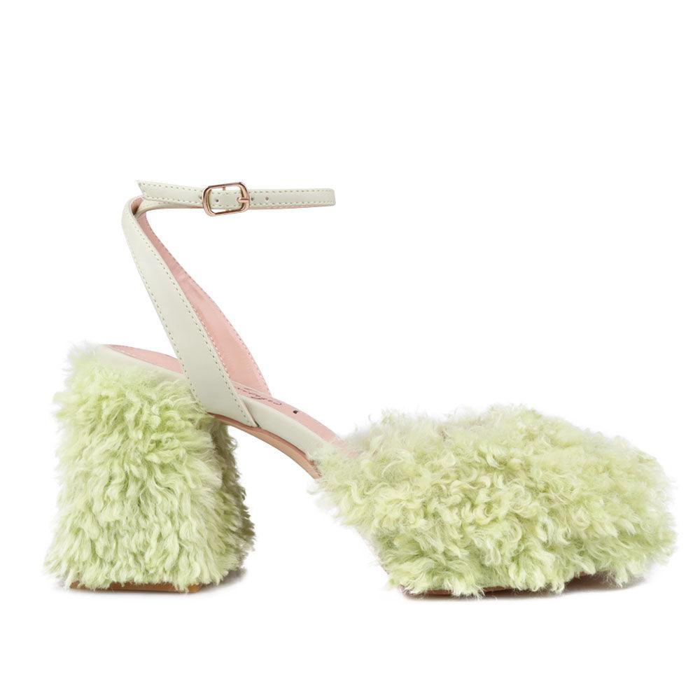 Green colored heel with vegan shearing upper-side view