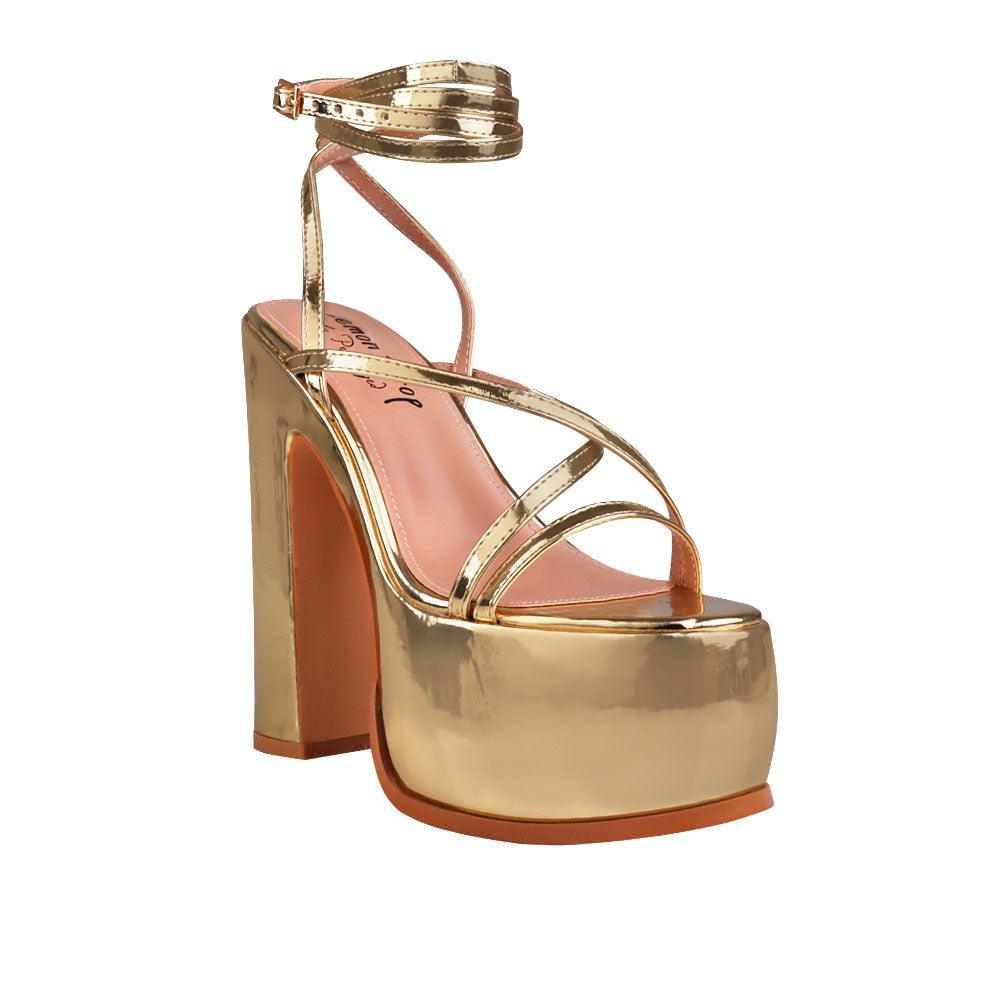 Golden colored women platform heels with straps-corner view