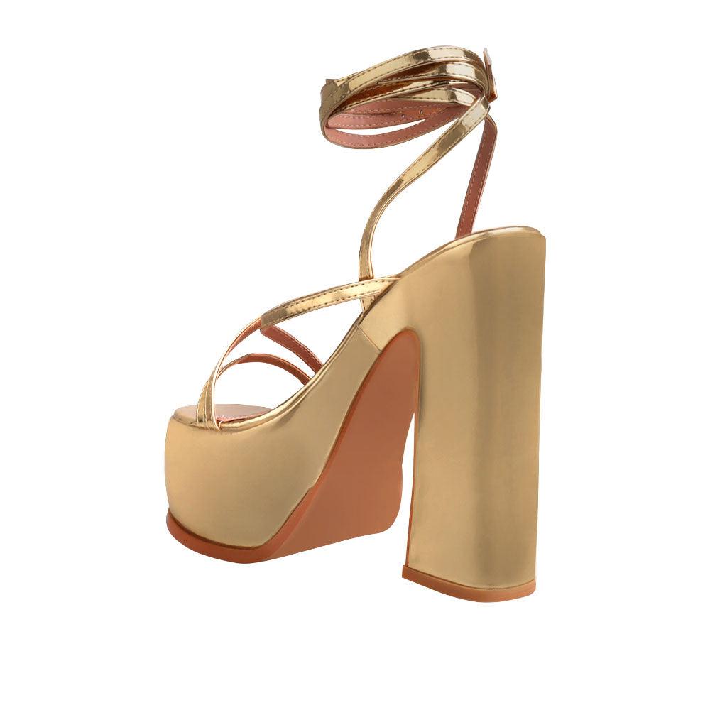 Golden colored women platform heels with straps-posterior view