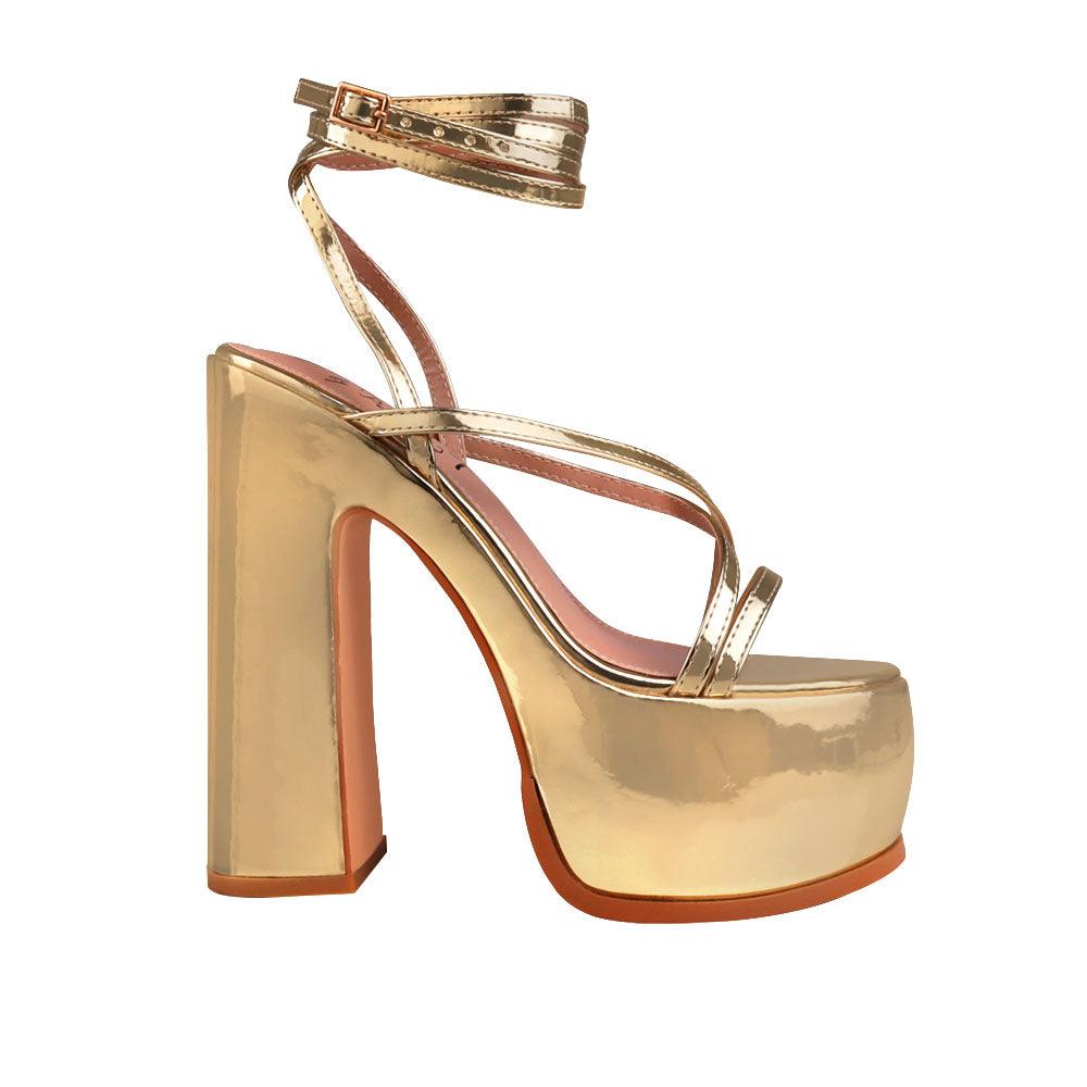 Golden colored women platform heels with straps-side view