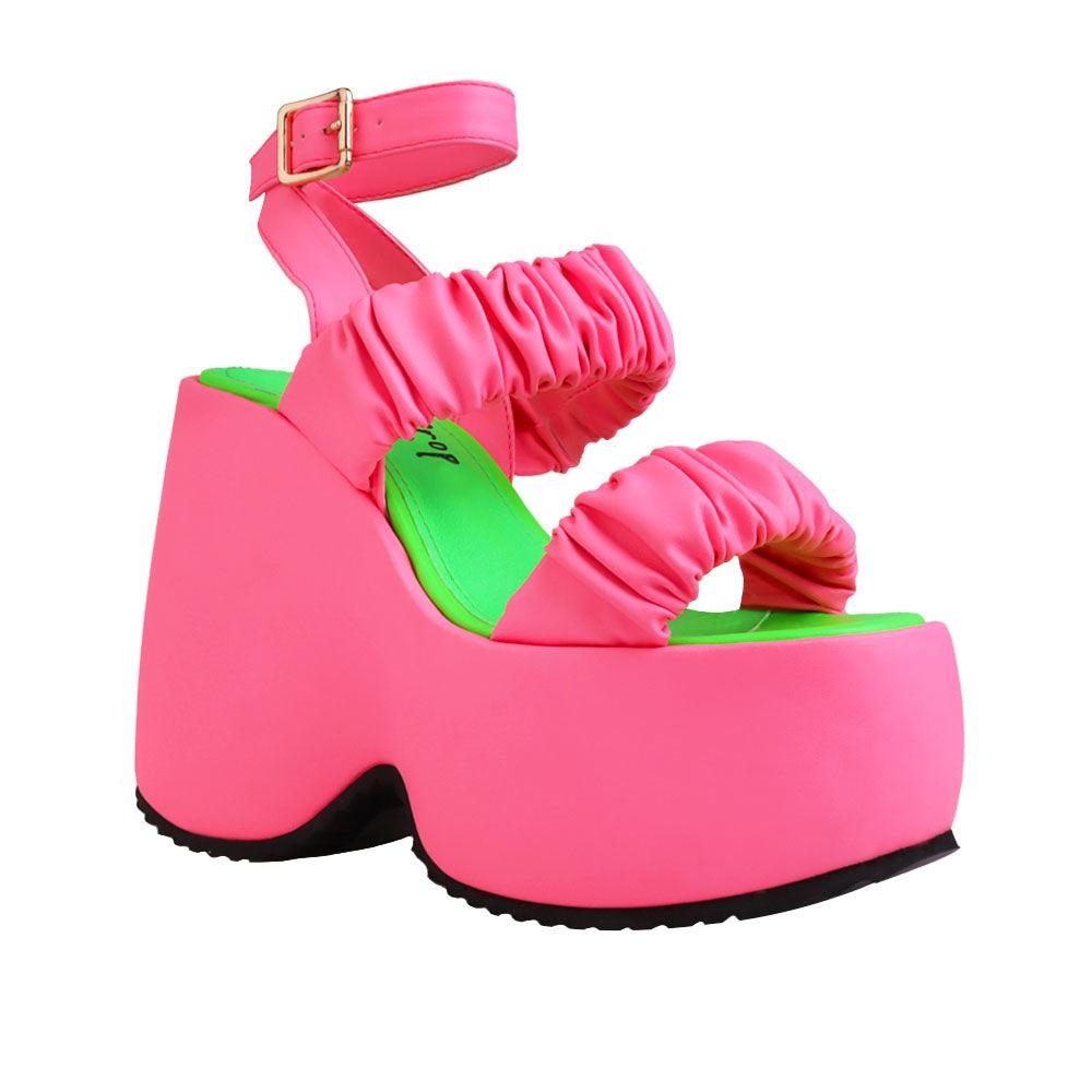 Pink women's platform with stretchy upper-corner view