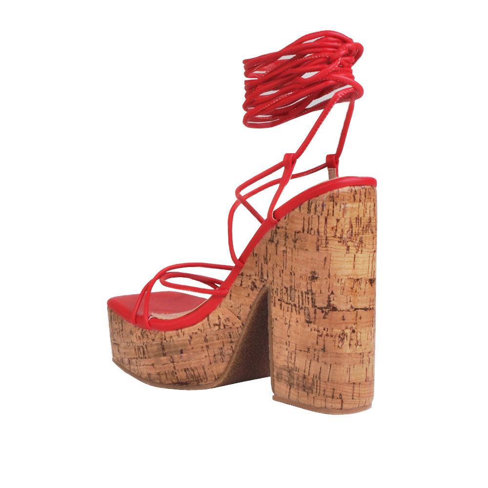 Red strappy women heels with brown platform-posterior view