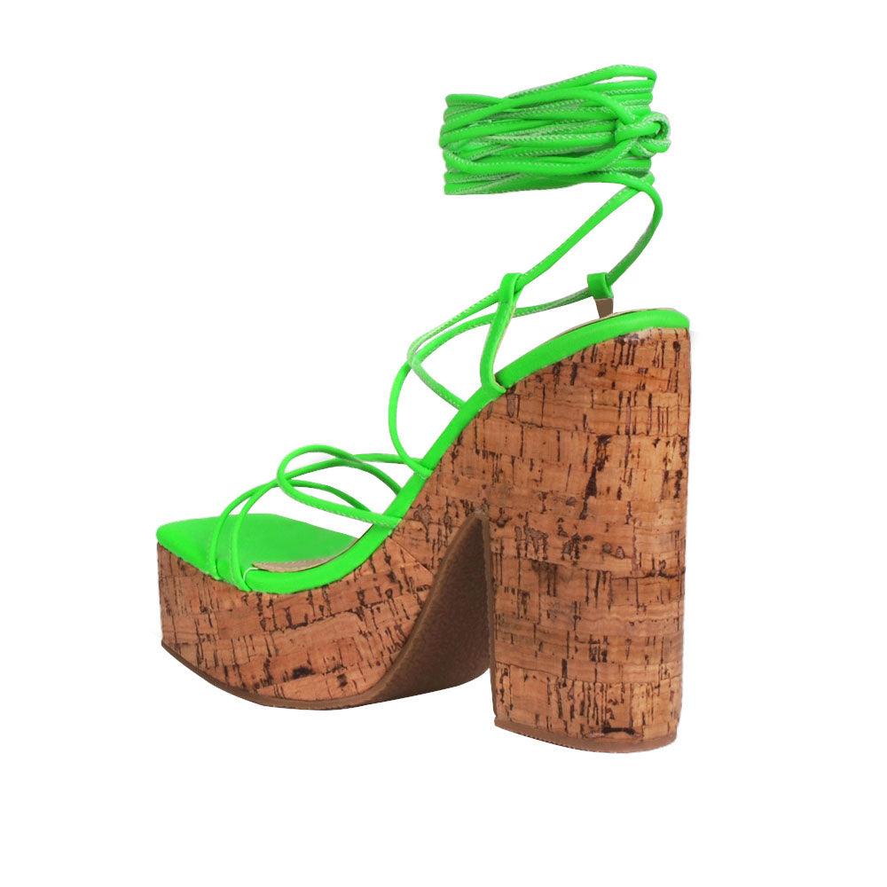 Green strappy women heels with brown platform-posterior view