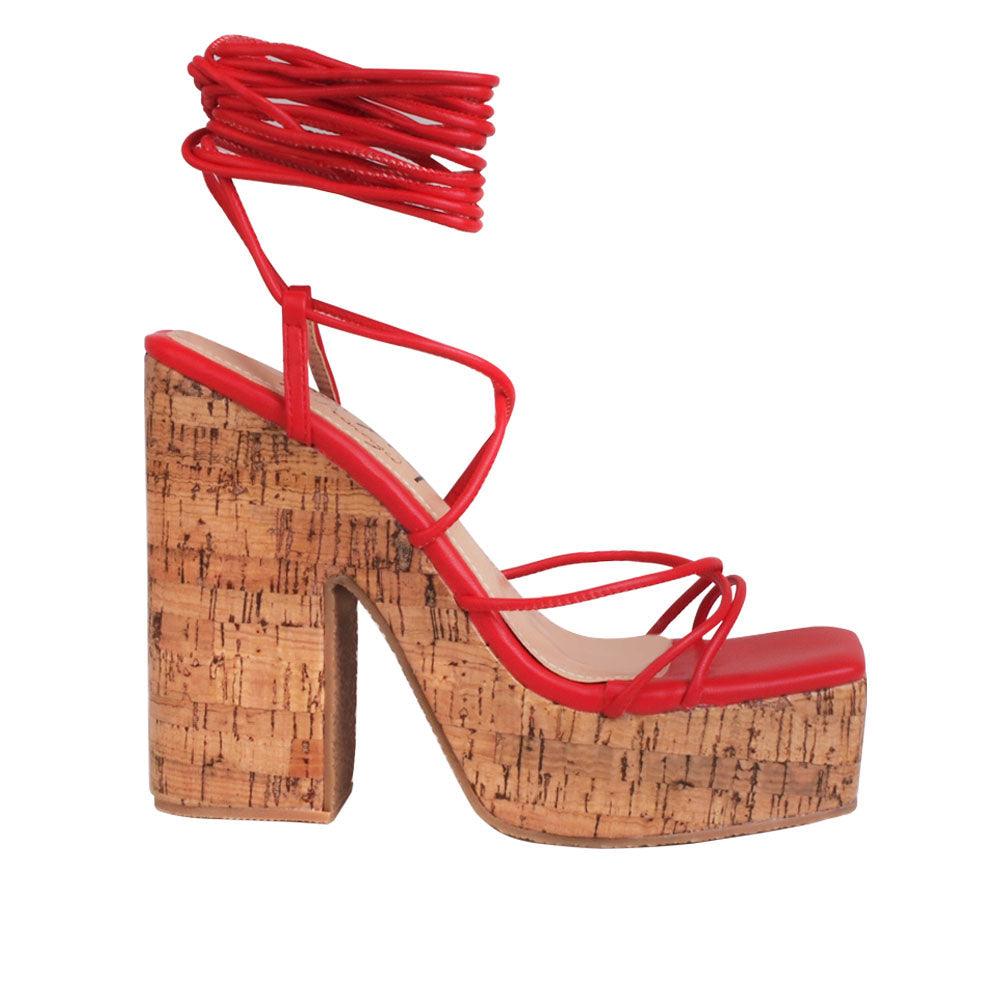 Red strappy women heels with brown platform-side view