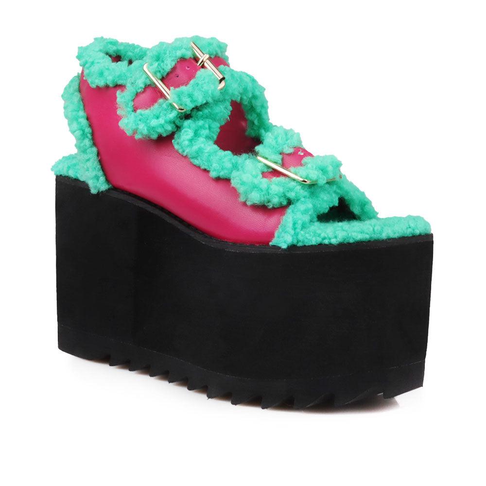 Black colored women platforms with green fur upper-corner view