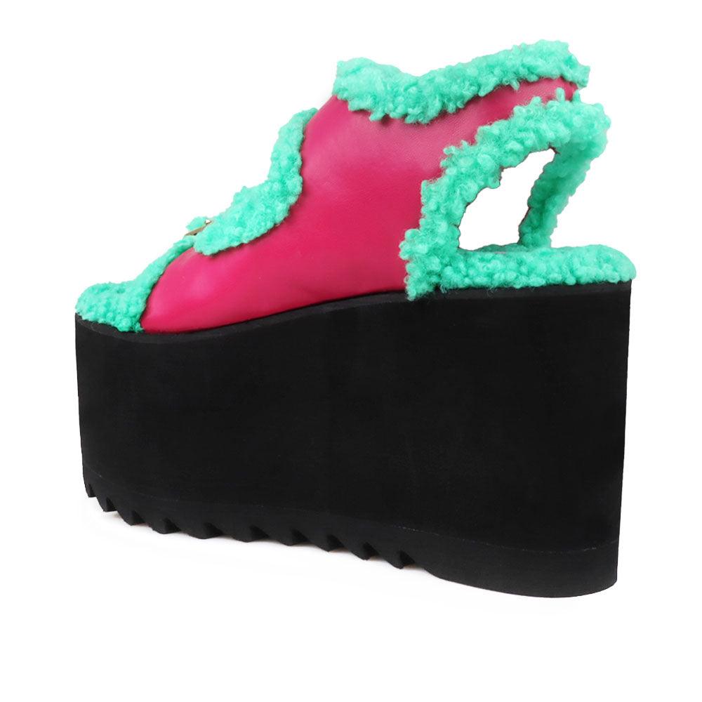 Black colored women platforms with green fur upper-posterior view