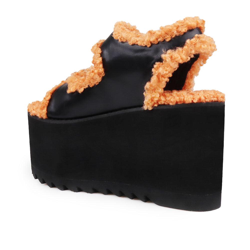 Black colored women platforms with orange fur upper-posterior view