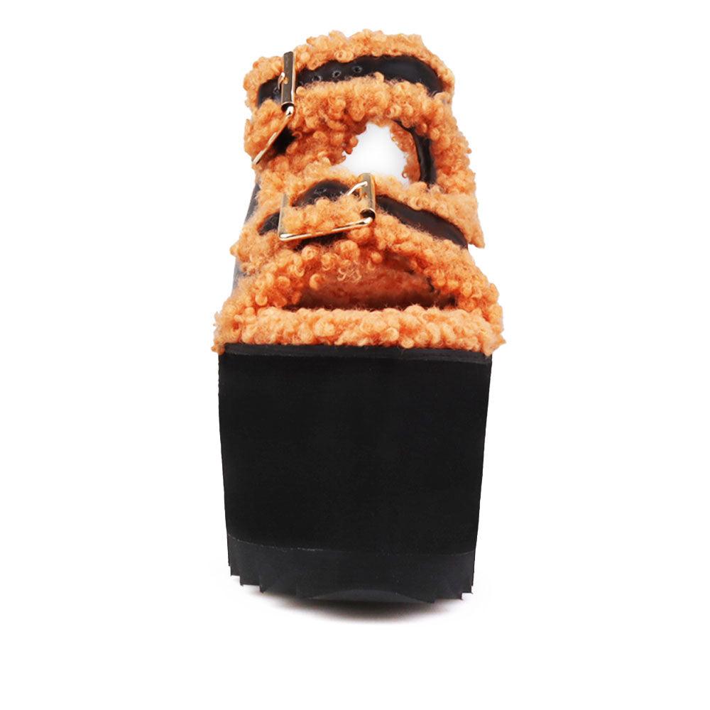 Black colored women platforms with orange fur upper-front view