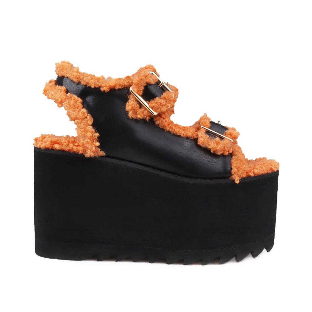 Black colored women platforms with orange fur upper-side view