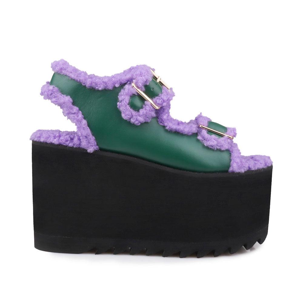 Black colored women platforms with purple fur upper-side view