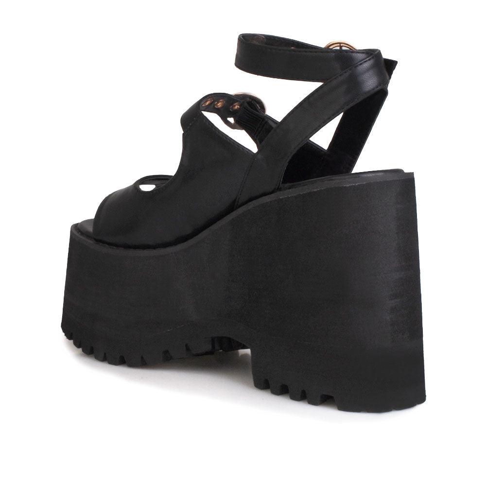 Black women platforms with black bottom and double ankle buckles-posterior view