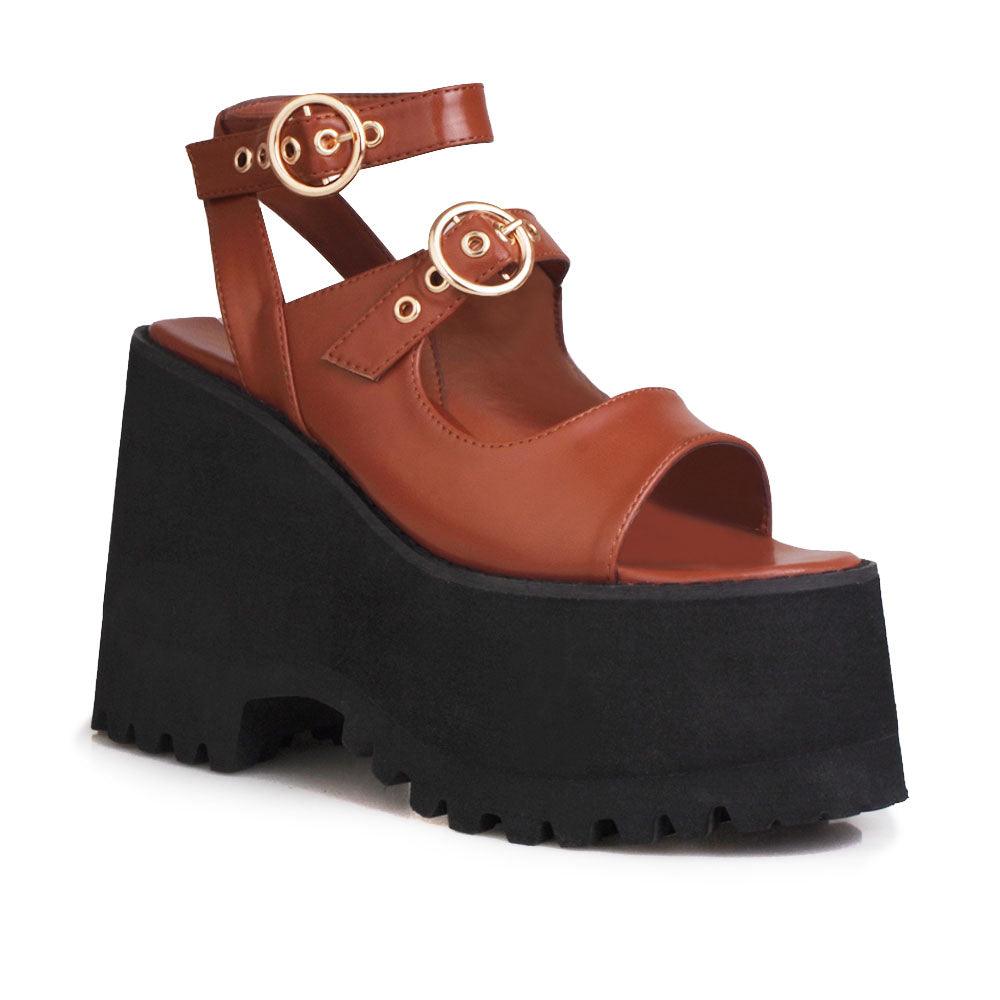 Brown women platforms with black bottom and double ankle buckles-corner view