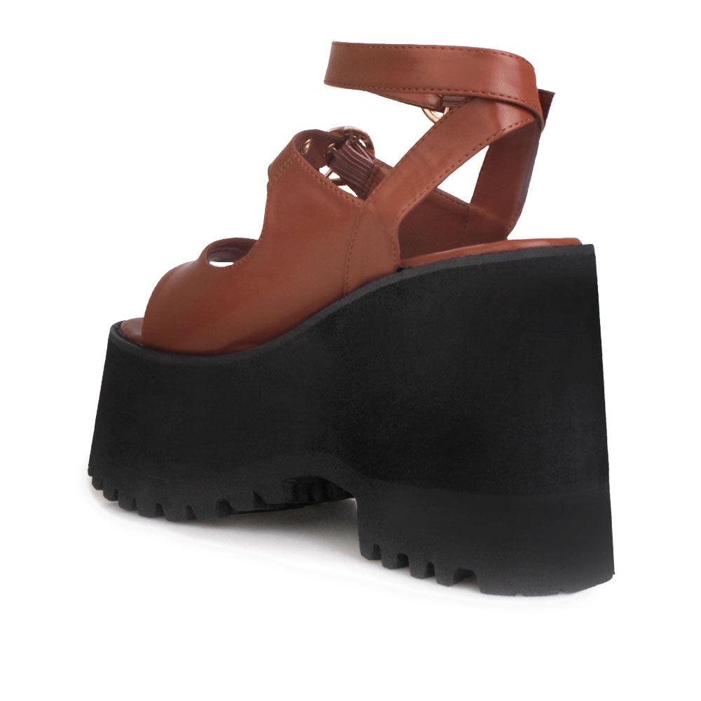 Brown women platforms with black bottom and double ankle buckles-posterior view