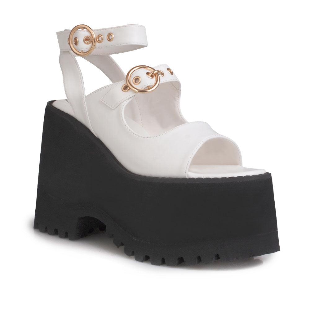 White women platforms with black bottom and double ankle buckles-corner view