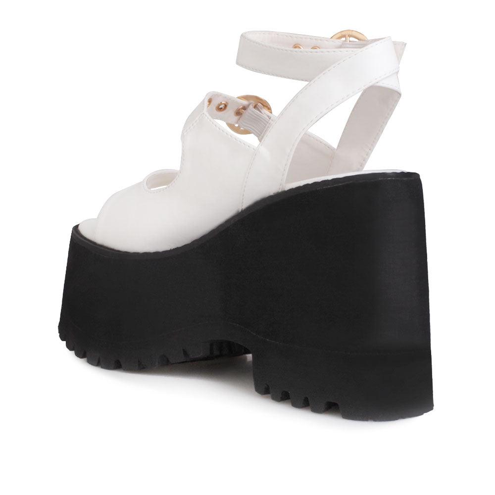 White women platforms with black bottom and double ankle buckles-posterior view