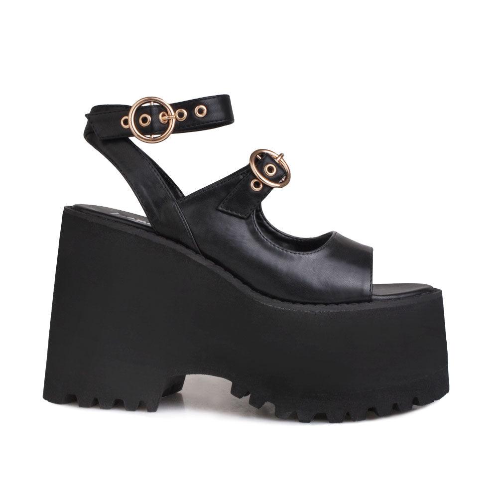 Black women platforms with black bottom and double ankle buckles-side view