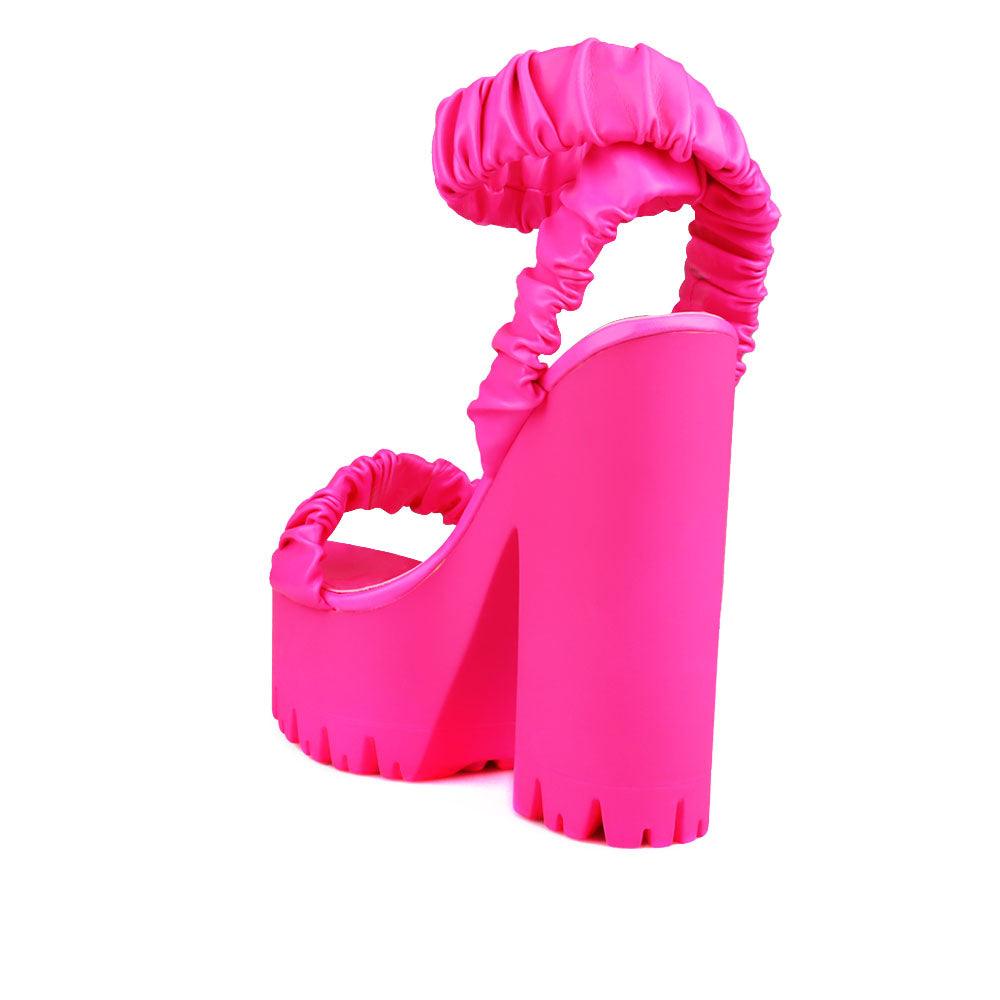 Women platform heels with velcro strap in neon pink-posterior view