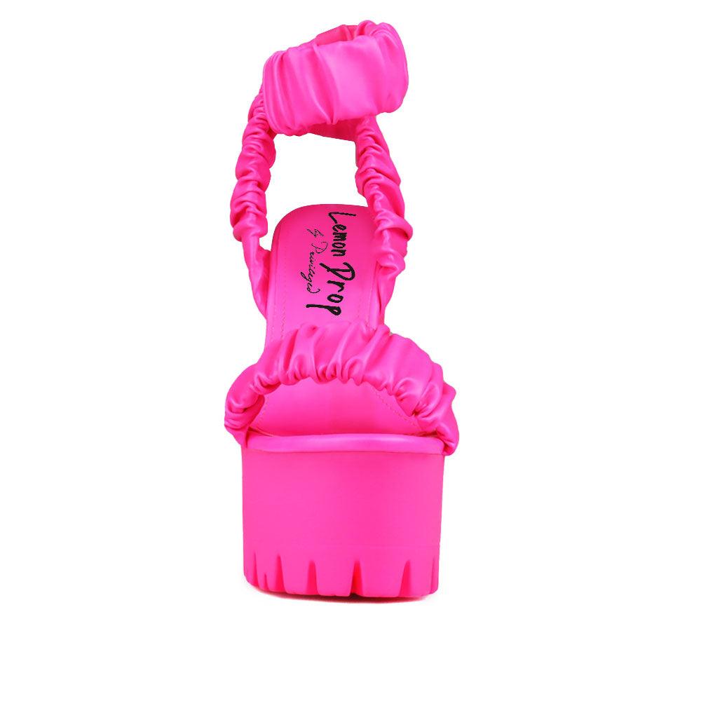 Women platform heels with velcro strap in neon pink-front view