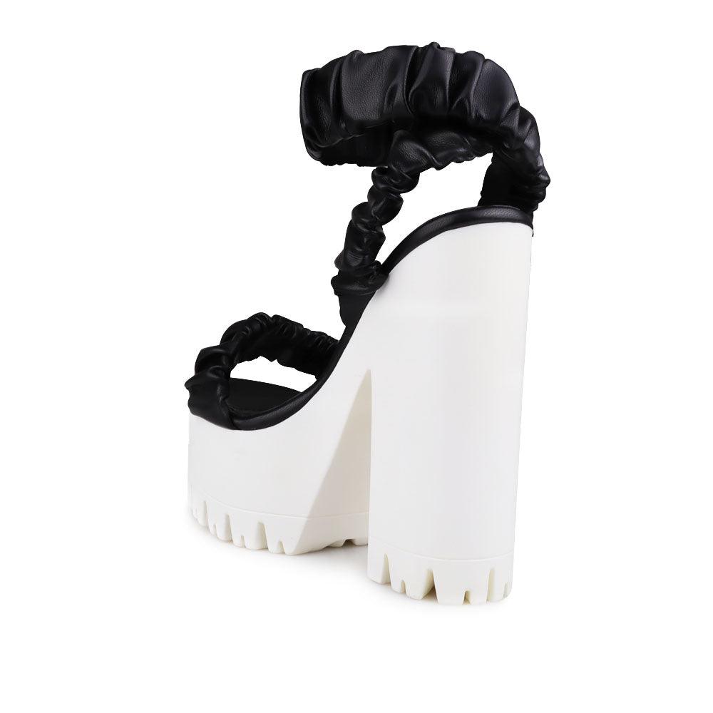 Women platform heels with velcro strap in black-posteriro view